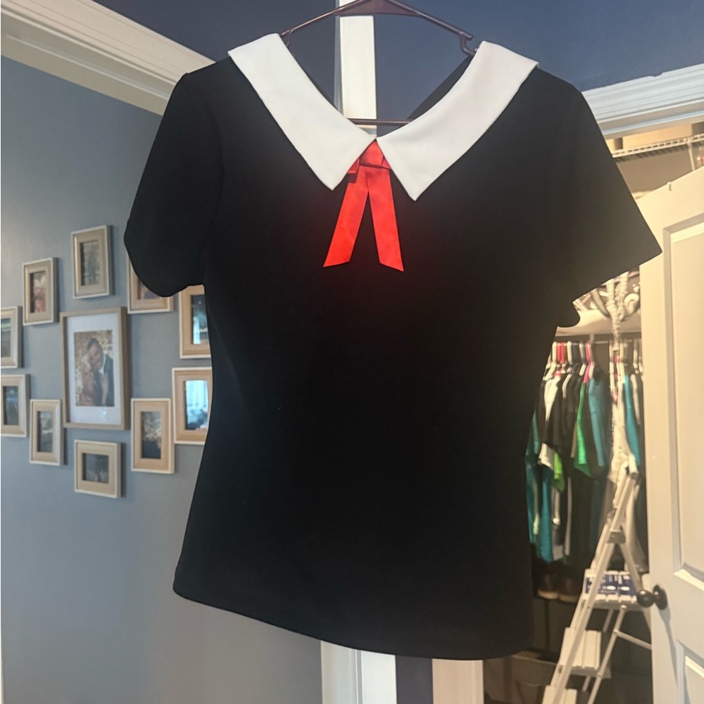 Black woman’s shirt  with White Collar and Red Bow
